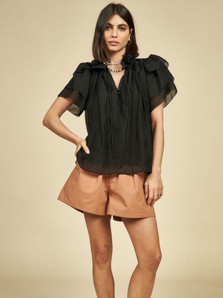 Hunter Bell Millie Top Features A Ruffled Collar And Tassel Tie Closure.
